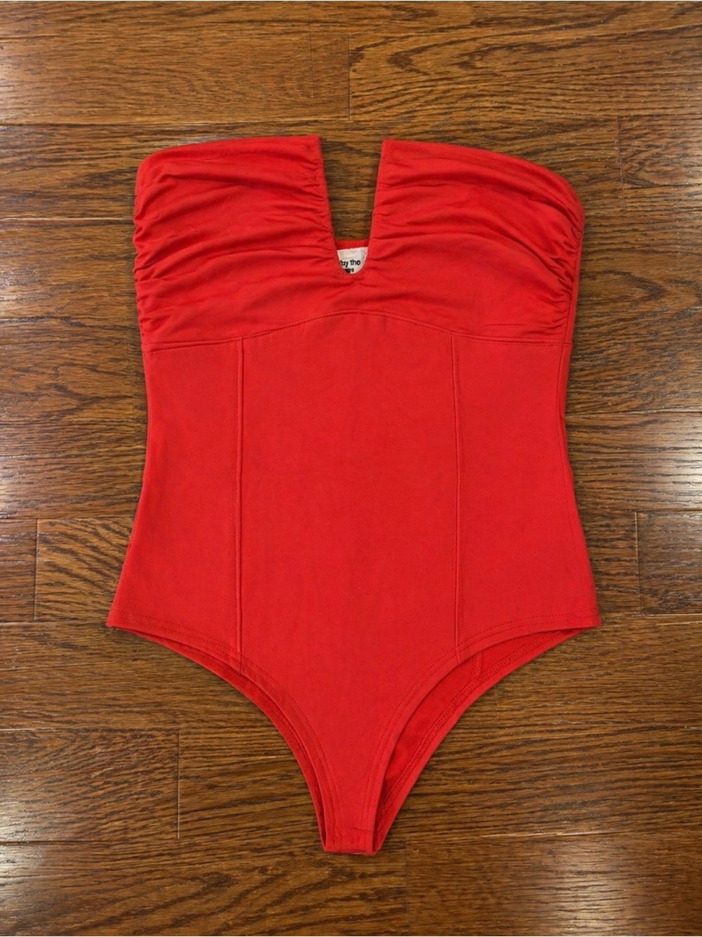 by the way. Strapless Red One-Piece Bodysuit with V-Notching